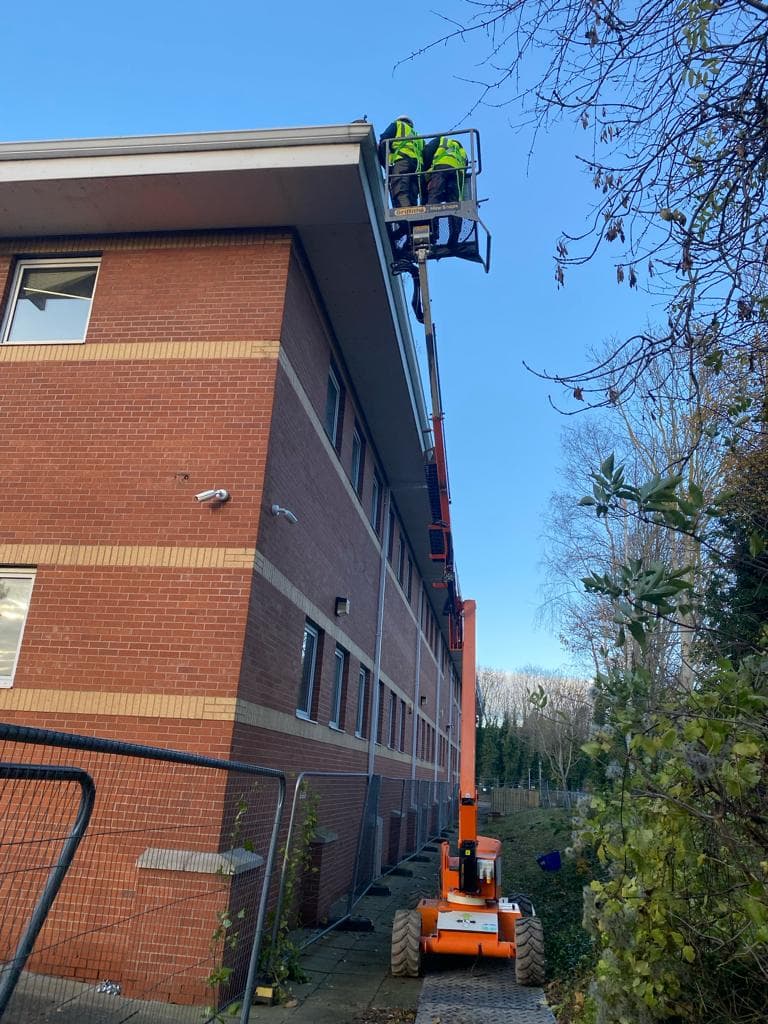 High-rise gutter clearing using specialist equipment